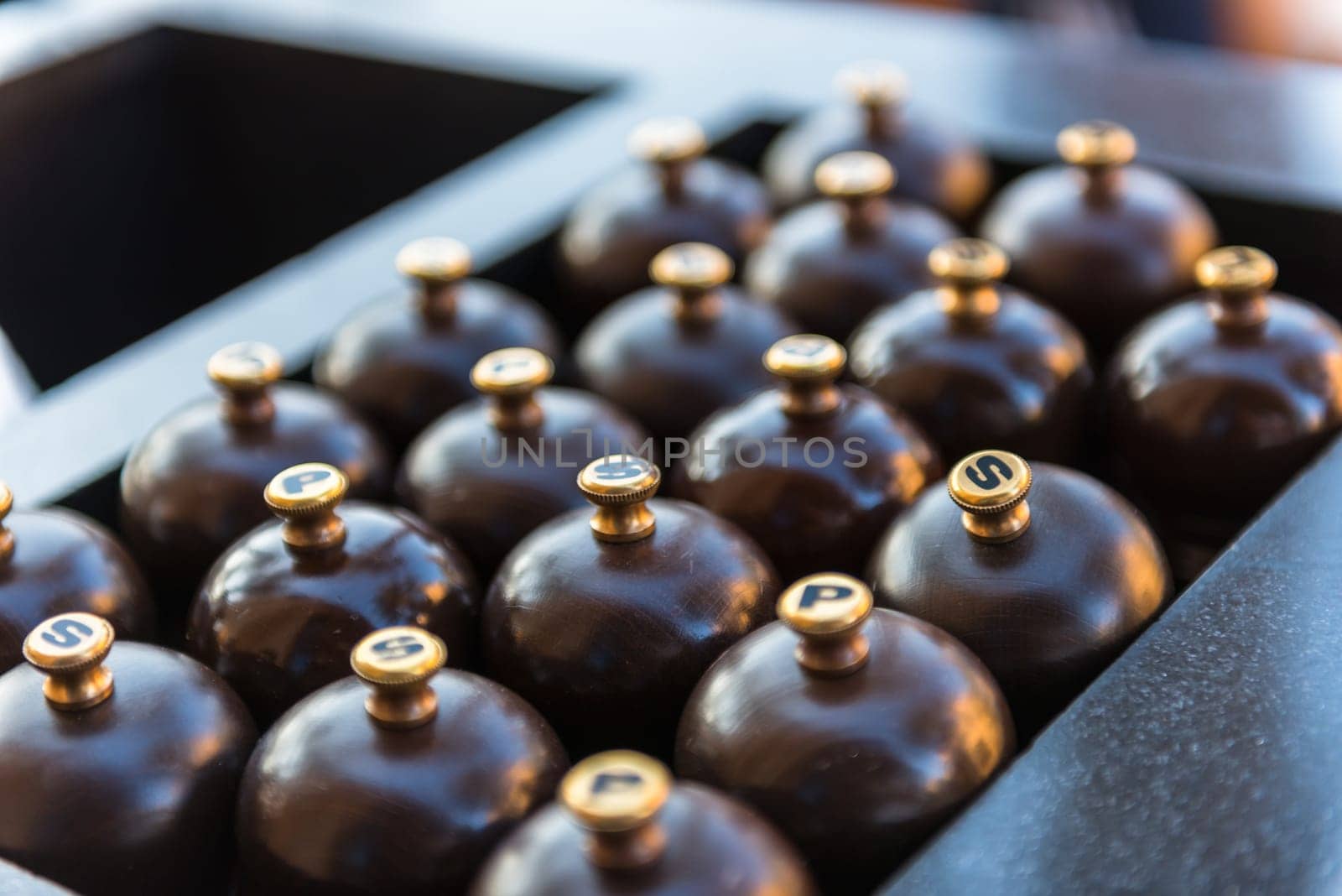 Number of wooden mills with salt and pepper in a restaurant. Shot with a small GRIP