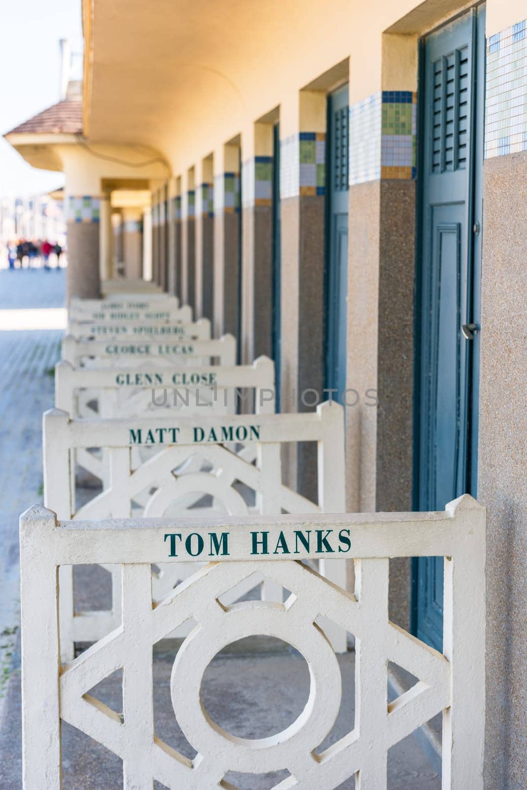 FRANCE, DEAUVILLE - SEPTEMBER 27: original beach closets with famous names on promenade Des Planches in Deauville, France on September 27, 2015