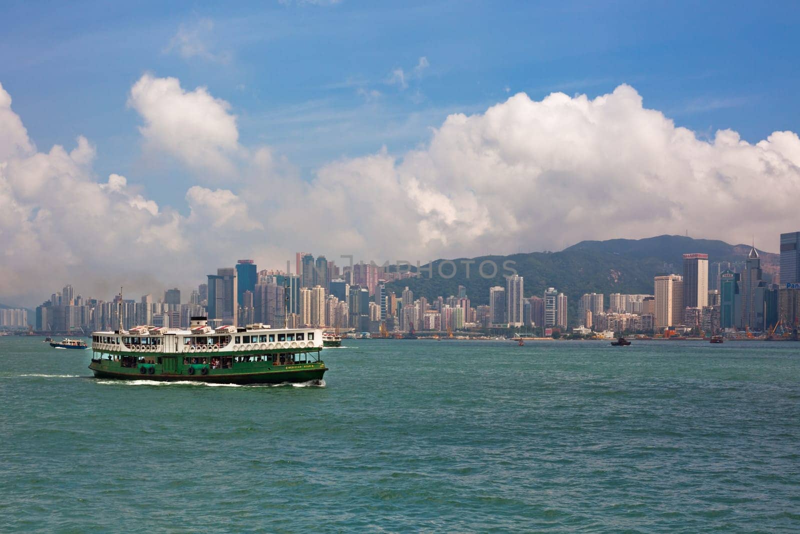 HONG KONG, HONG KONG - SEPTEMBER 22: famous ferry on Victoria harbor in Hong Kong with tall buildings on September 22, 2012