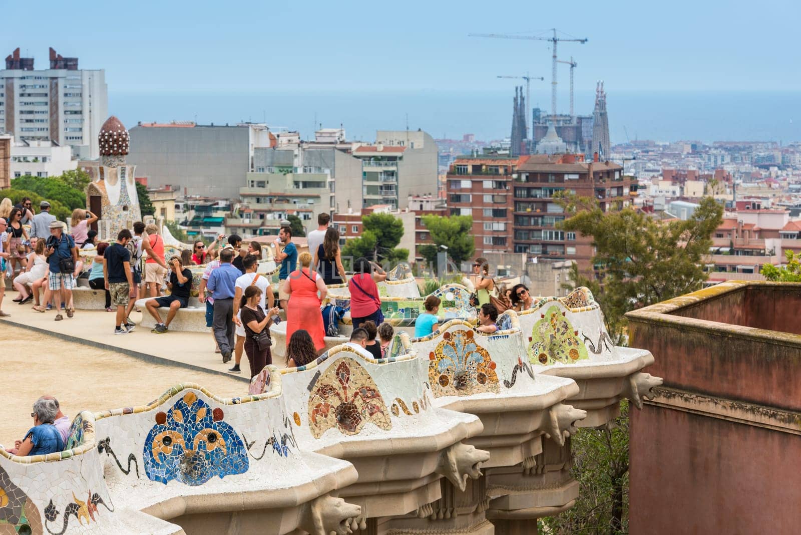 SPAIN, BARCELONA - SEPTEMBER 13: Tourists in Park Guell, Barcelona, Spain on September 13, 2015