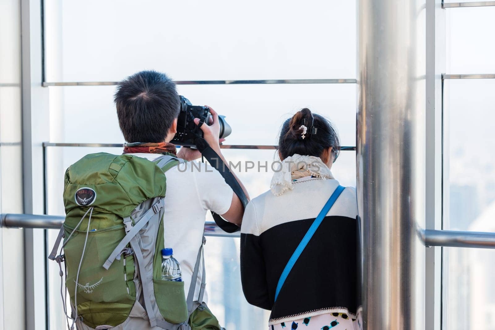 DUBAI, UAE - JANUARY 02: people at the top the observation deck of the highest building in the world Burj al Khalifa on January 02, 2015 in Dubai, United Arab Emirates