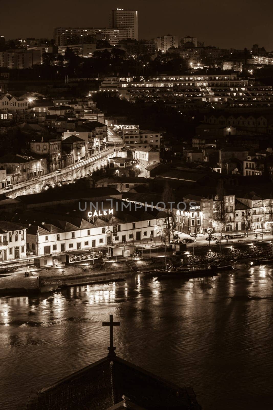 PORTUGAL, PORTO - JANUARY 20: Overview of Vila Nova de Gaia, district of Porto, Portugal at night on January 20, 2013. The world famous Port wine is stored here.