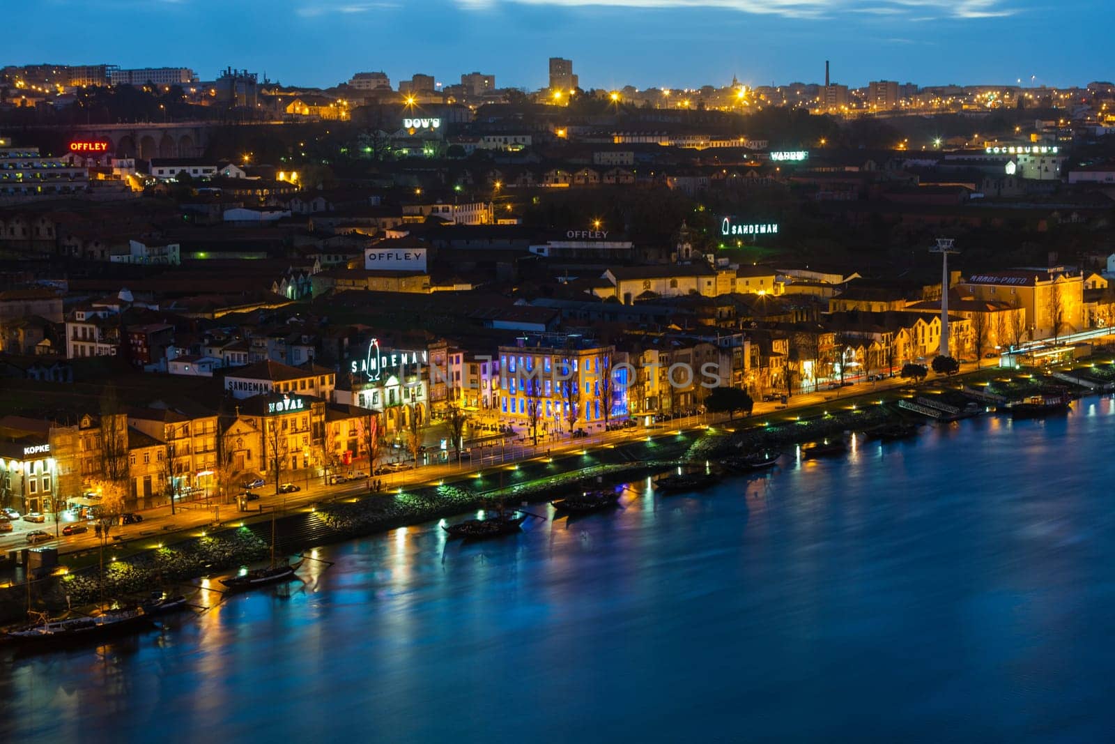 PORTUGAL, PORTO - JANUARY 20: Overview of Vila Nova de Gaia, district of Porto, Portugal at night on January 20, 2013. The world famous Port wine is stored here.