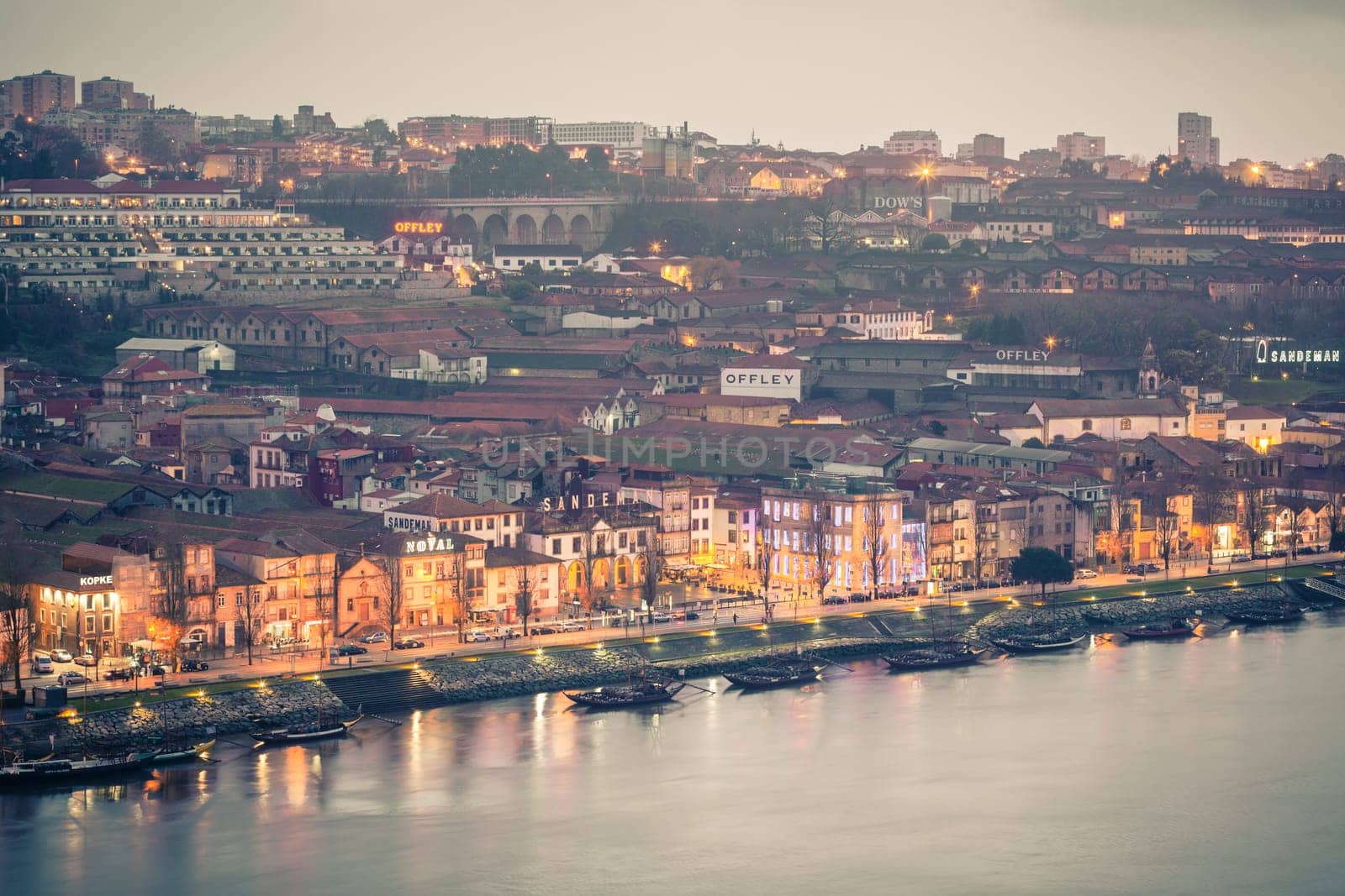 PORTUGAL, PORTO - JANUARY 20: Overview of Vila Nova de Gaia, district of Porto, Portugal at night on January 20, 2013. The world famous Port wine is stored here.