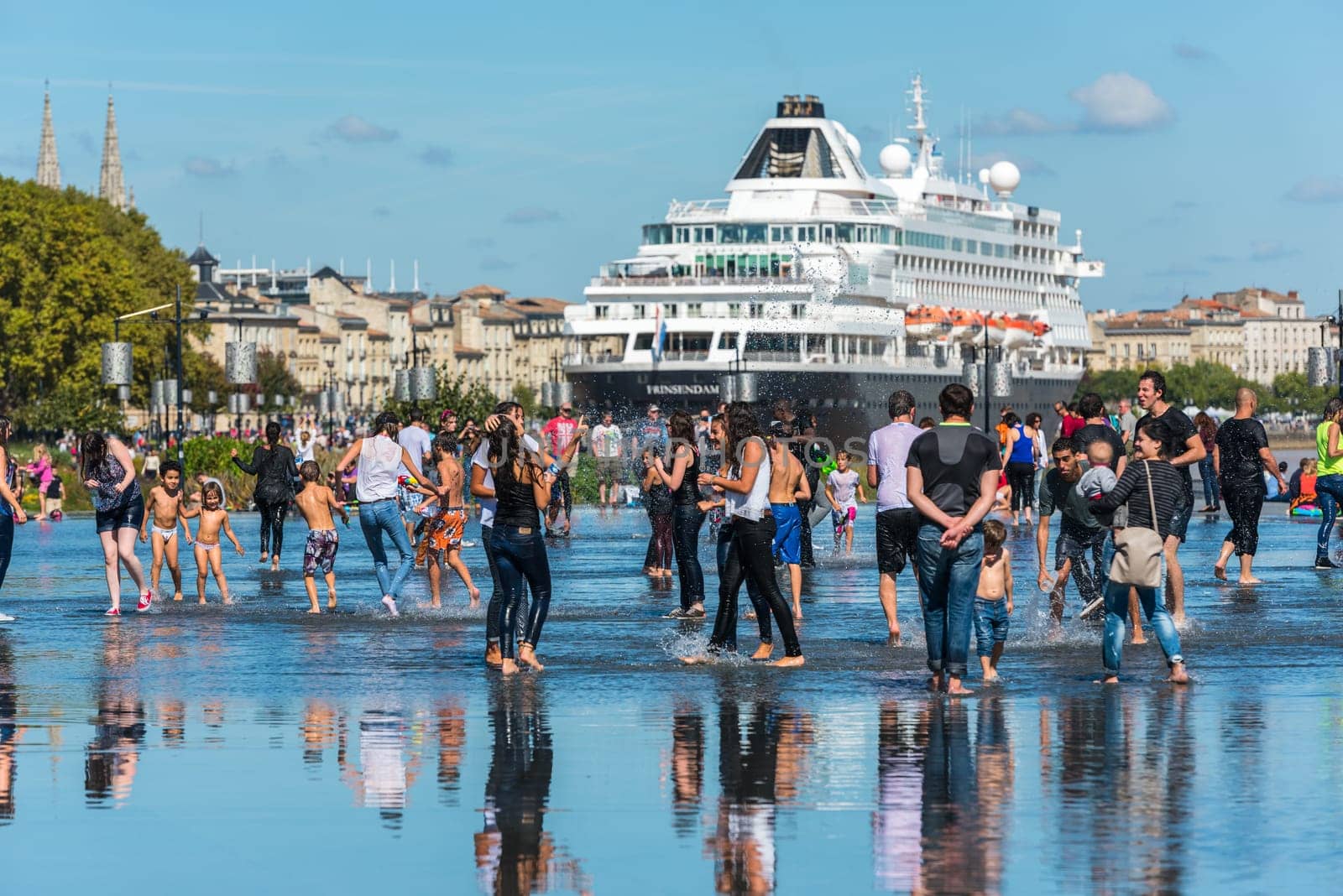 FRANCE, BORDEAUX - SEPTEMBER 20: Young people having fun and Famous dutch cruise ship Prinsendam in Bordeaux, France on September 20, 2015