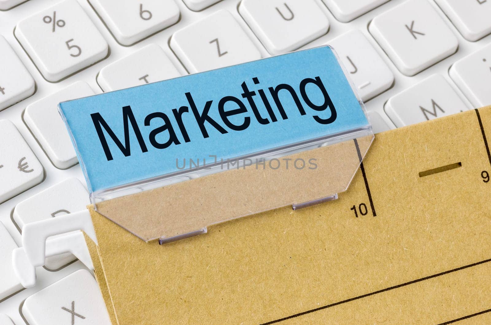 A brown file folder labeled with Marketing