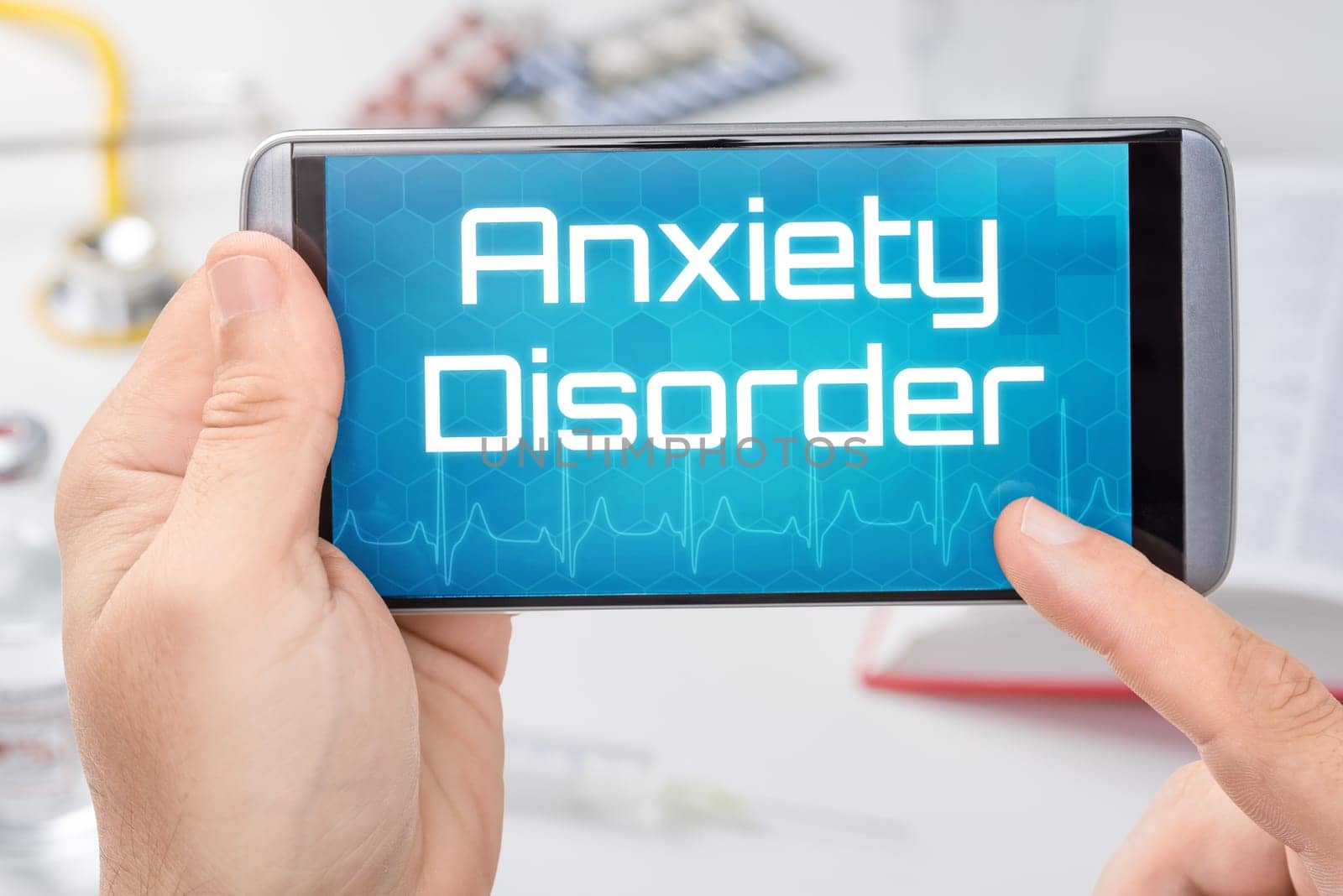 A smartphone with the text Anxiety disorder