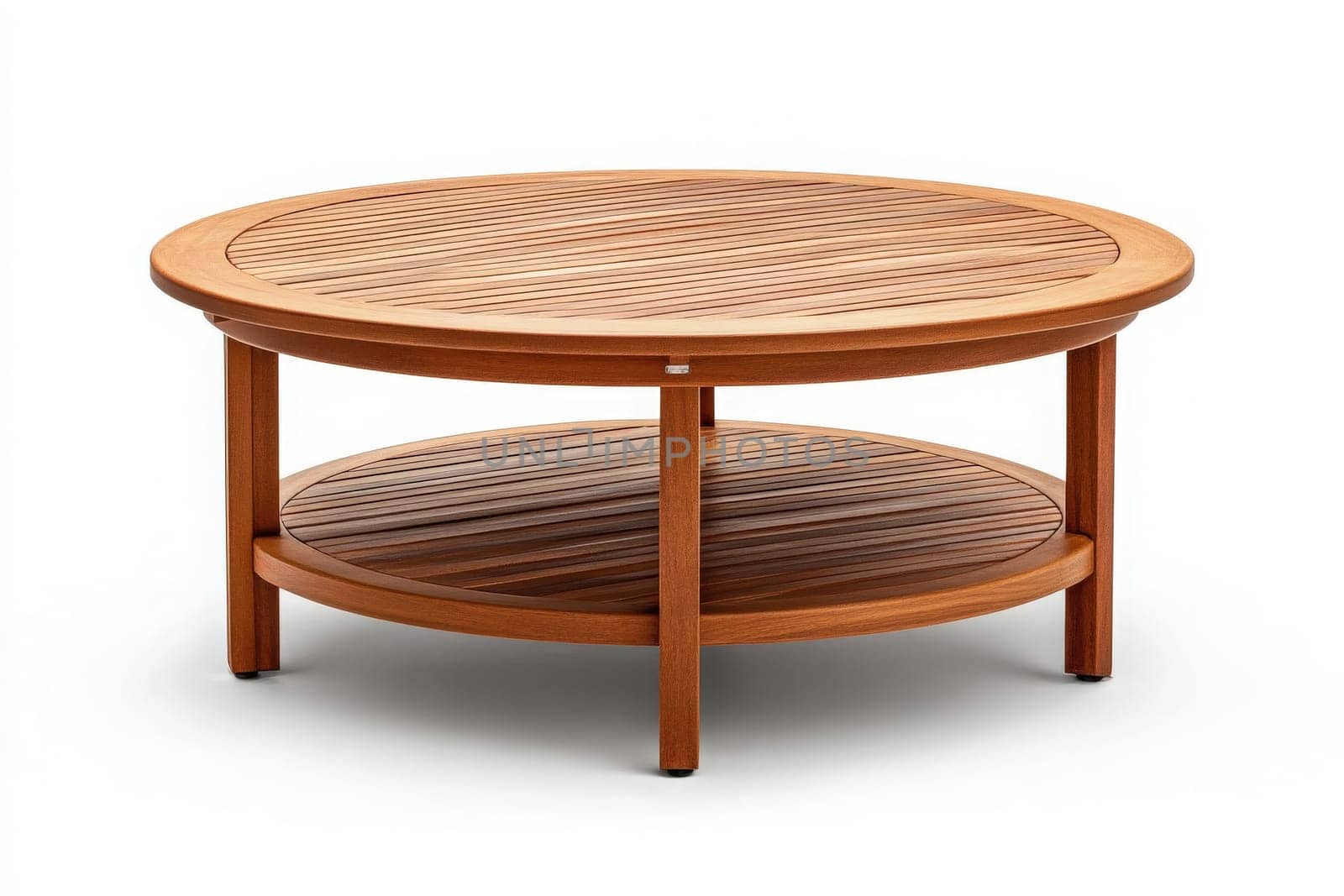 A round outdoor coffee table sits in the center of a peaceful area, inviting moments of leisure and conversation. Its wooden finish complements the natural surroundings beautifully.