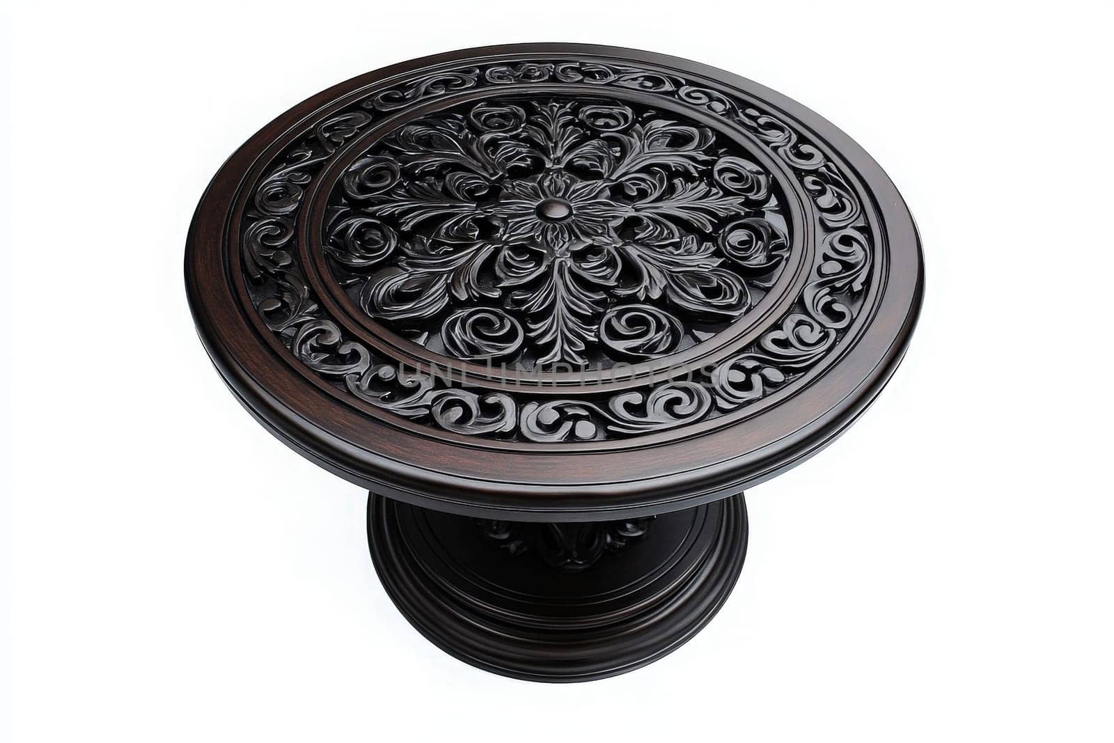 This isolated round patio table features a beautifully carved floral pattern, showcasing craftsmanship and style. Perfect for outdoor settings, it invites dining and relaxation.