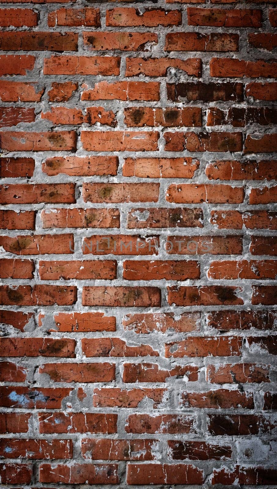 Panorama of red old brick wall. Detailed texture of aged masonry with broken bricks and peeling plaster. Pattern of loft interior or exterior background. Urban, grunge, industrial, abstract backdrop