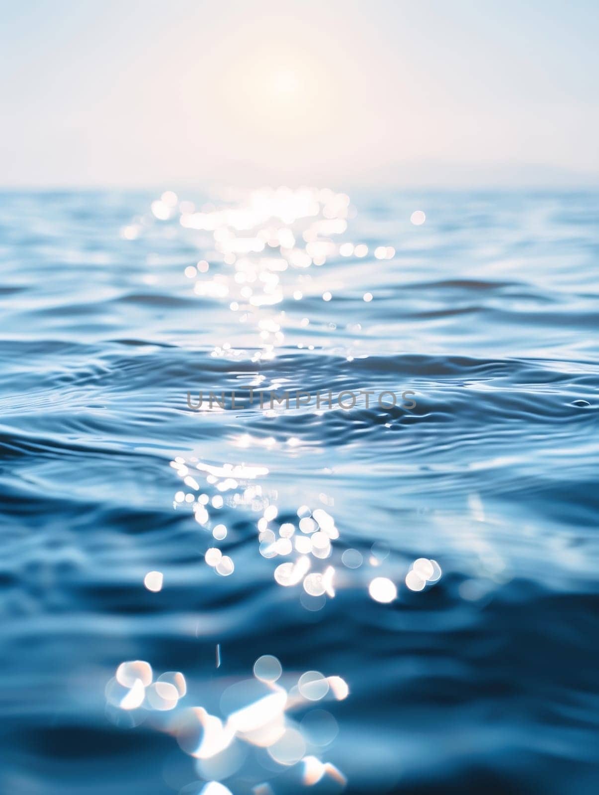 Captivating waves in the soft light of dusk, their surfaces dancing with shimmering, scattered reflections of the fading sky