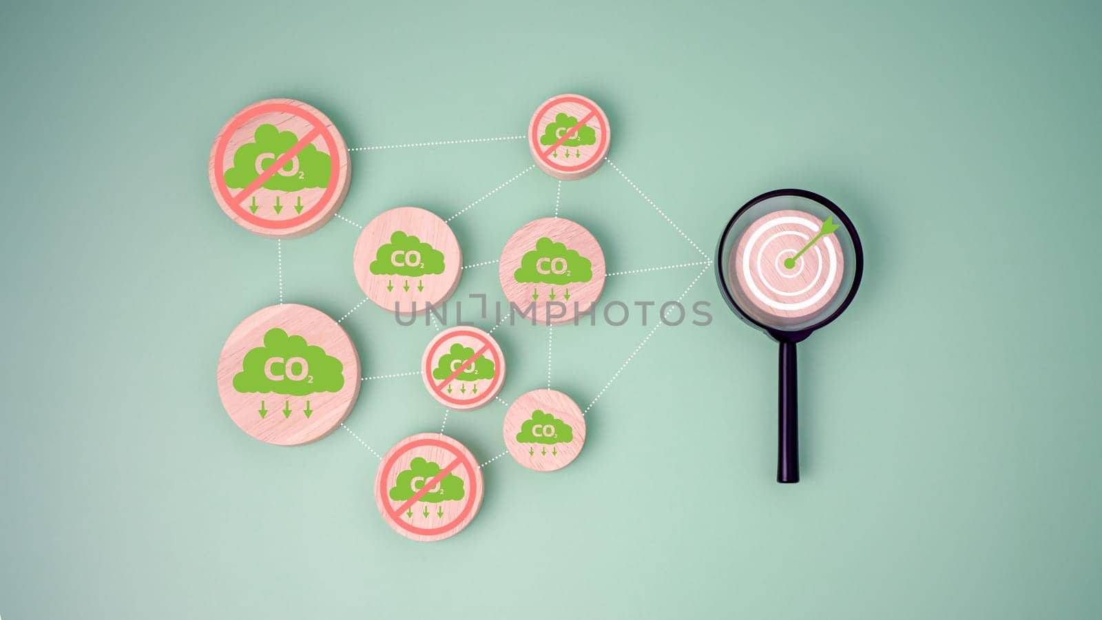 CO2 reducing icon on Circular wooden plate Connect with Target board icon inside magnifying glass for focusing decrease carbon dioxide emission target, Carbon footprint and carbon credit concept.