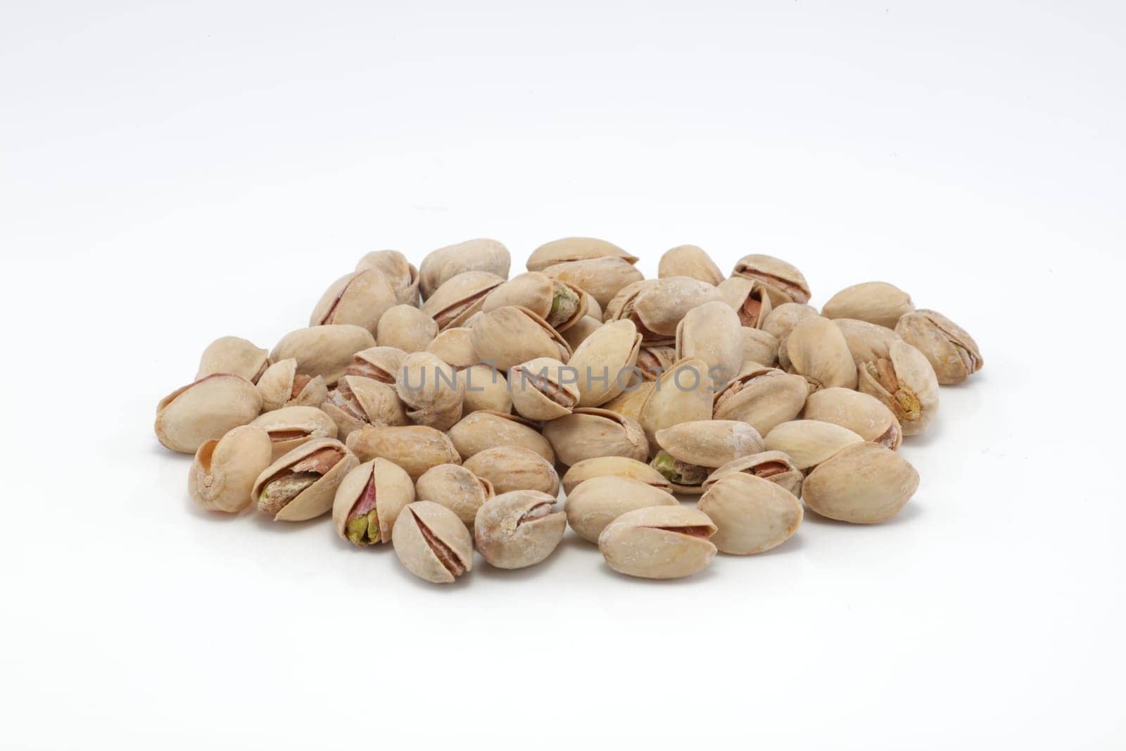 A pistachio nuts in shells group isolated on white