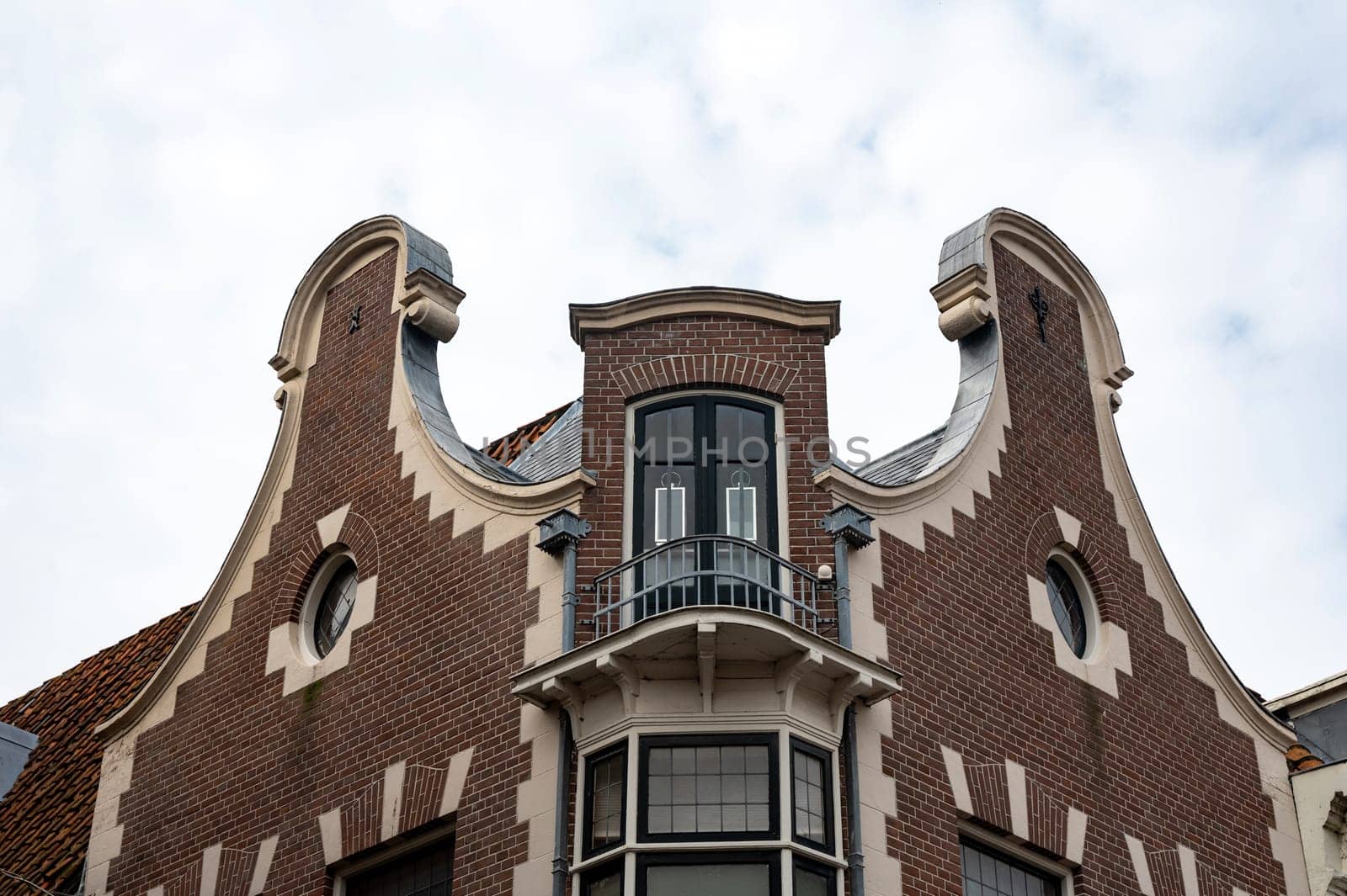 Colorful house facades with sky in the old town of Alkmaar in the Netherlands