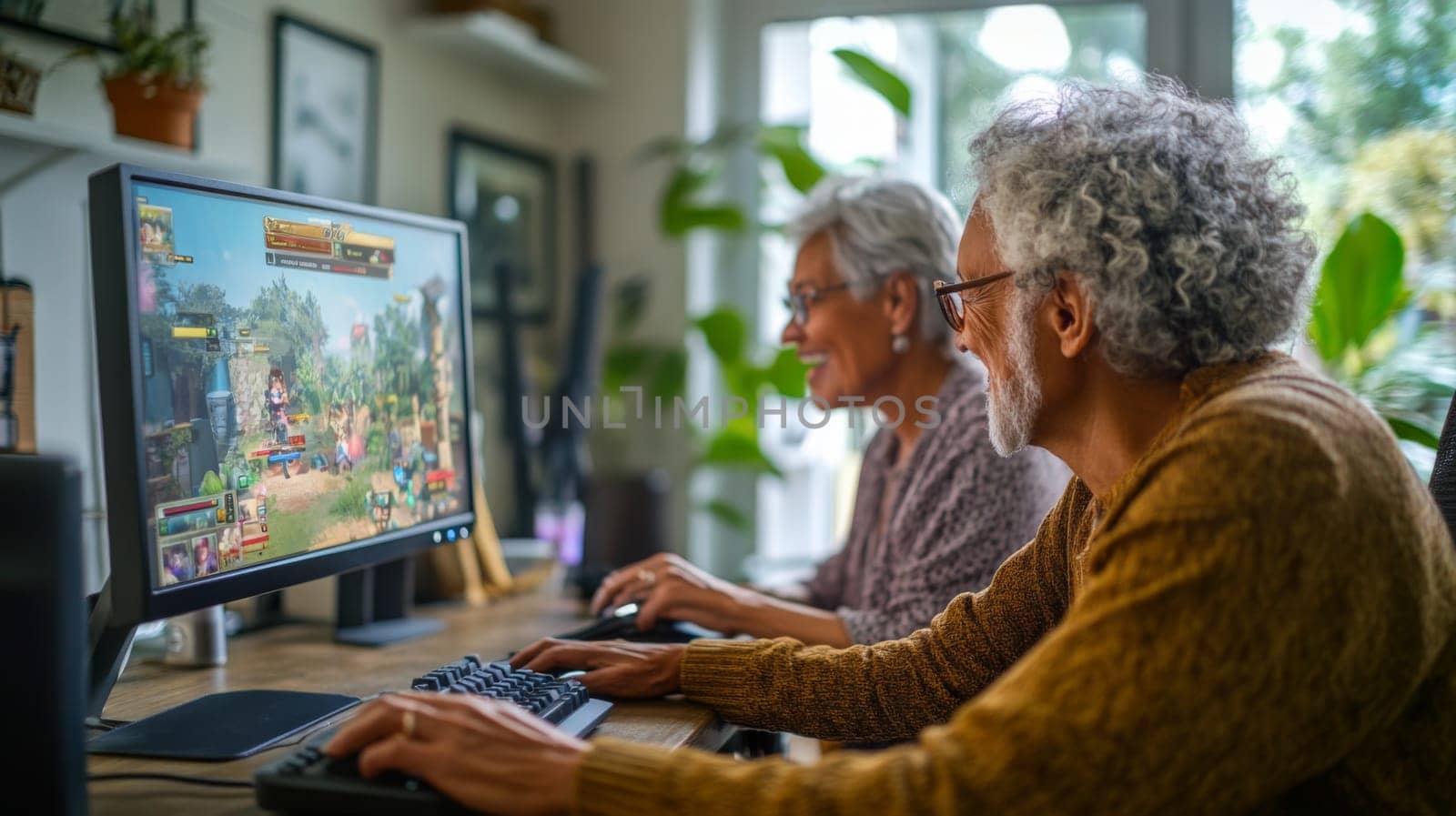 Senior multiracial couple enjoying video game together on computer monitors, concept of leisure