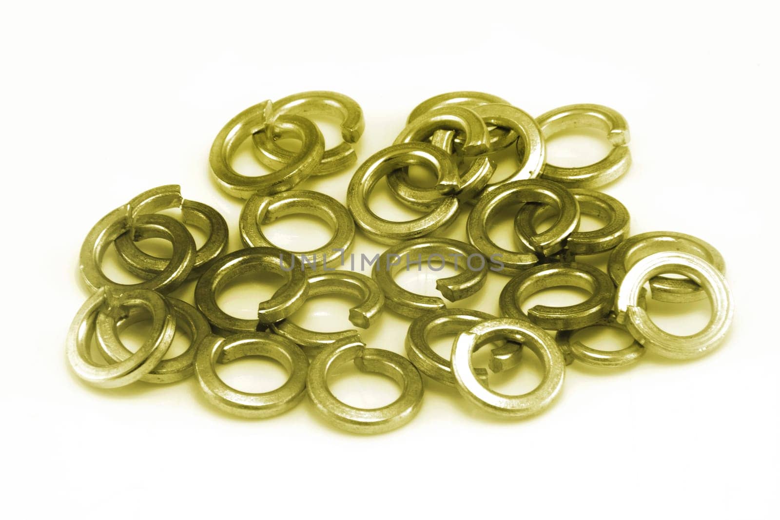 A pile of phosphor bronze split spring washers on white background