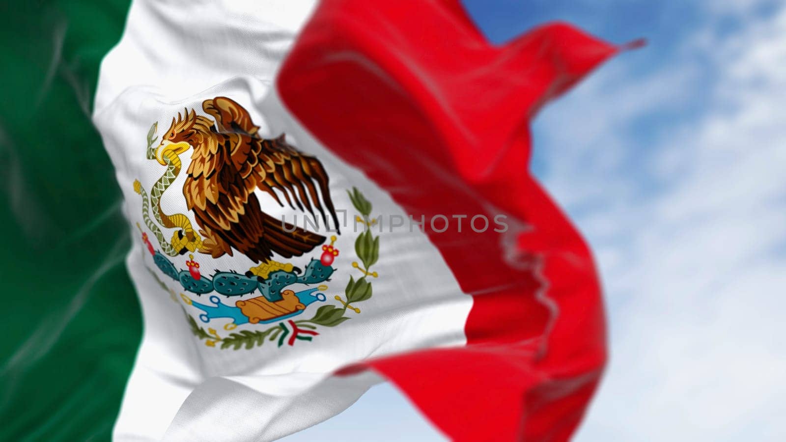 Mexico national flags waving on a clear day. Tricolor of green, white, and red with national coat of arms in the center of the white stripe. 3D illustration render. Rippled textile. Selective focus