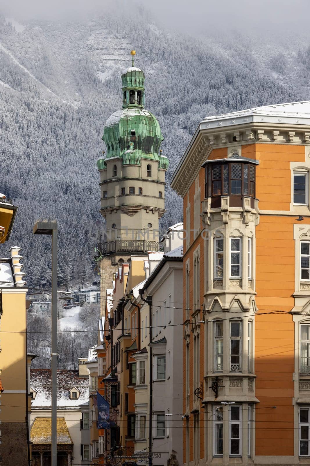 Innsbruck, Austria - February 26, 2023: City tower (Stadtturm) of Innsbruck Town Hall located at Herzog-Friedrich street