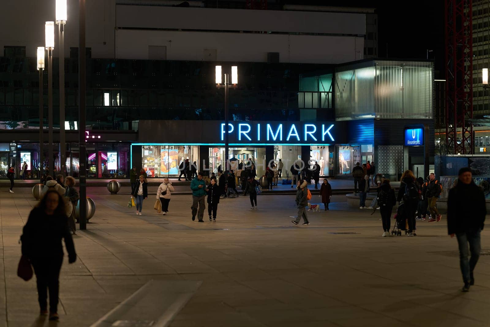 Street scene with some people at Primark on Alexanderplatz in Berlin in Germany in the evening