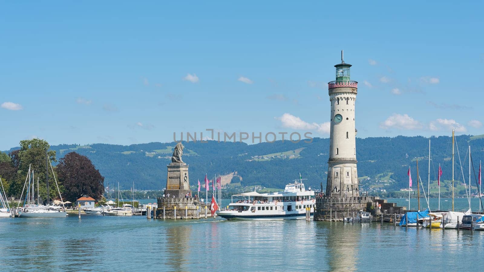 Harbor entrance of Lindau on Lake Constance, Bodensee with an arriving passenger ship