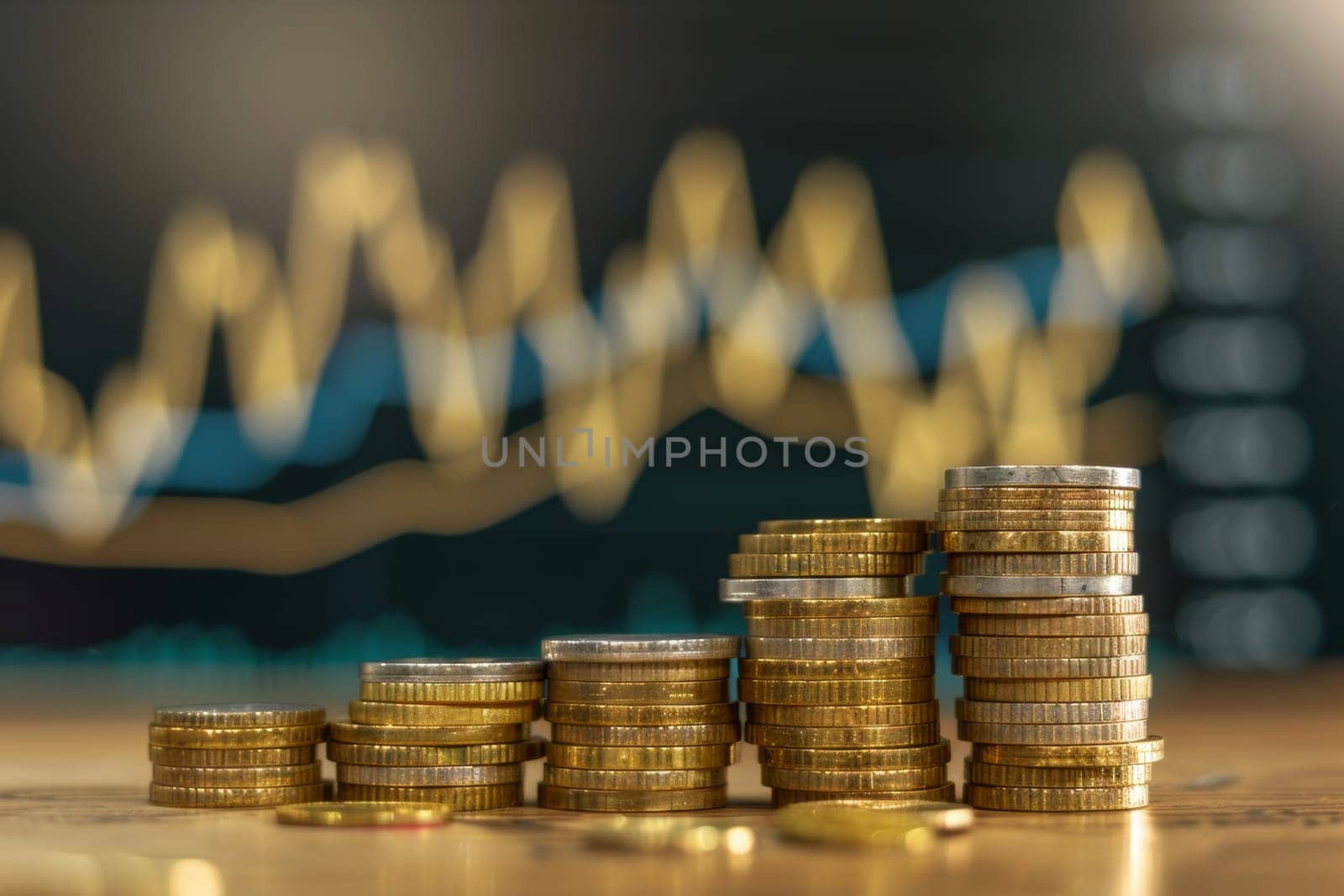 A stack of gold coins with a growth chart in the background, investment growth concept
