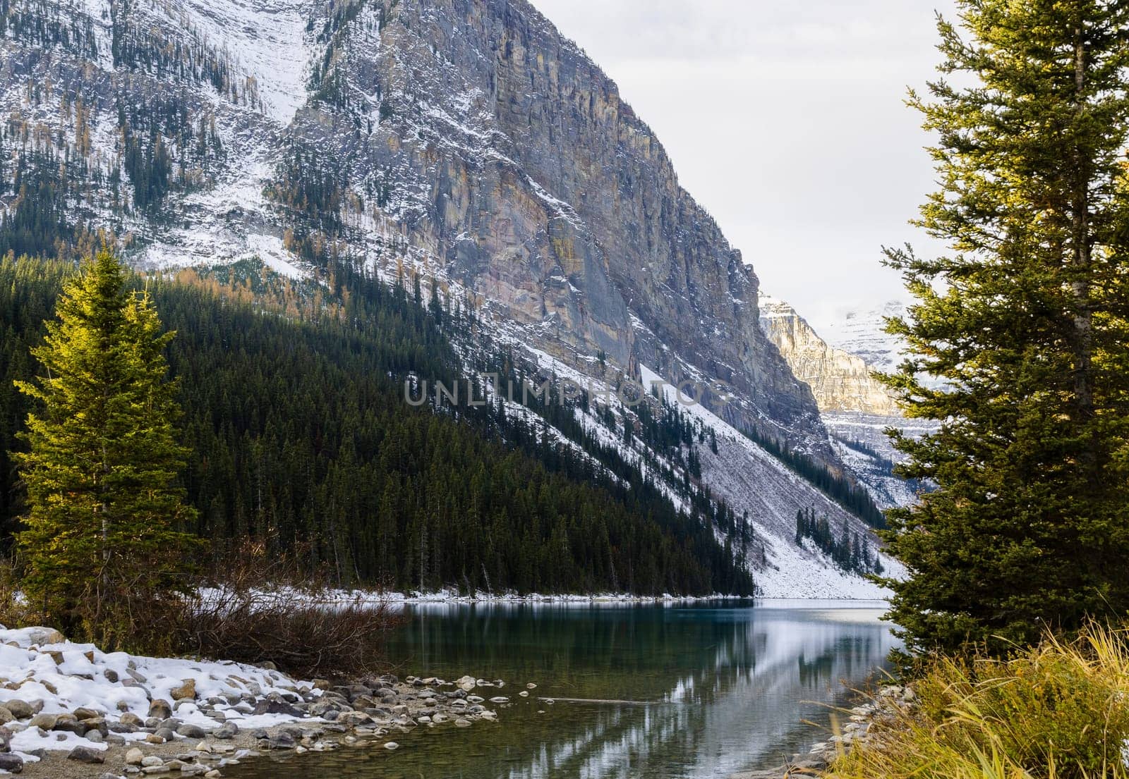 Early winter view of Fairview Mountain with reflection on Lake Louise in Banff National Park, Alberta, Canada