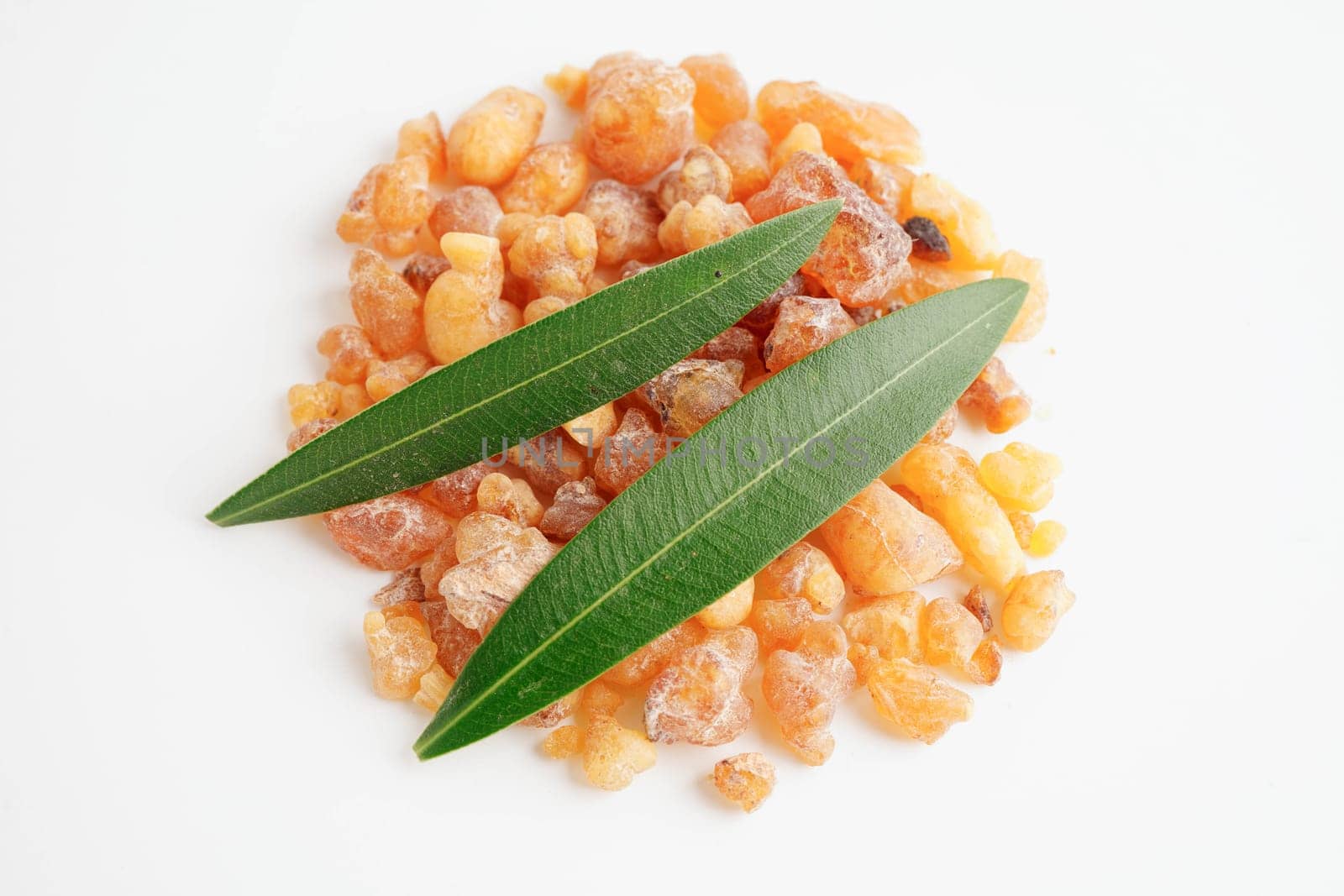 Frankincense or olibanum aromatic resin isolated on white background used in incense and perfumes.