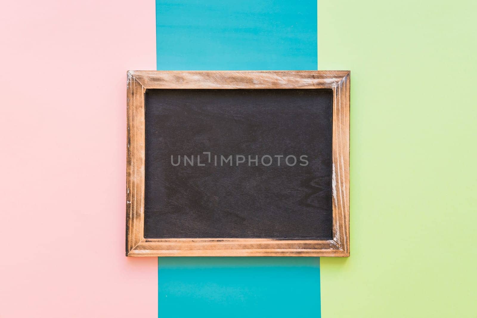 slate with wooden border colorful background. High resolution photo