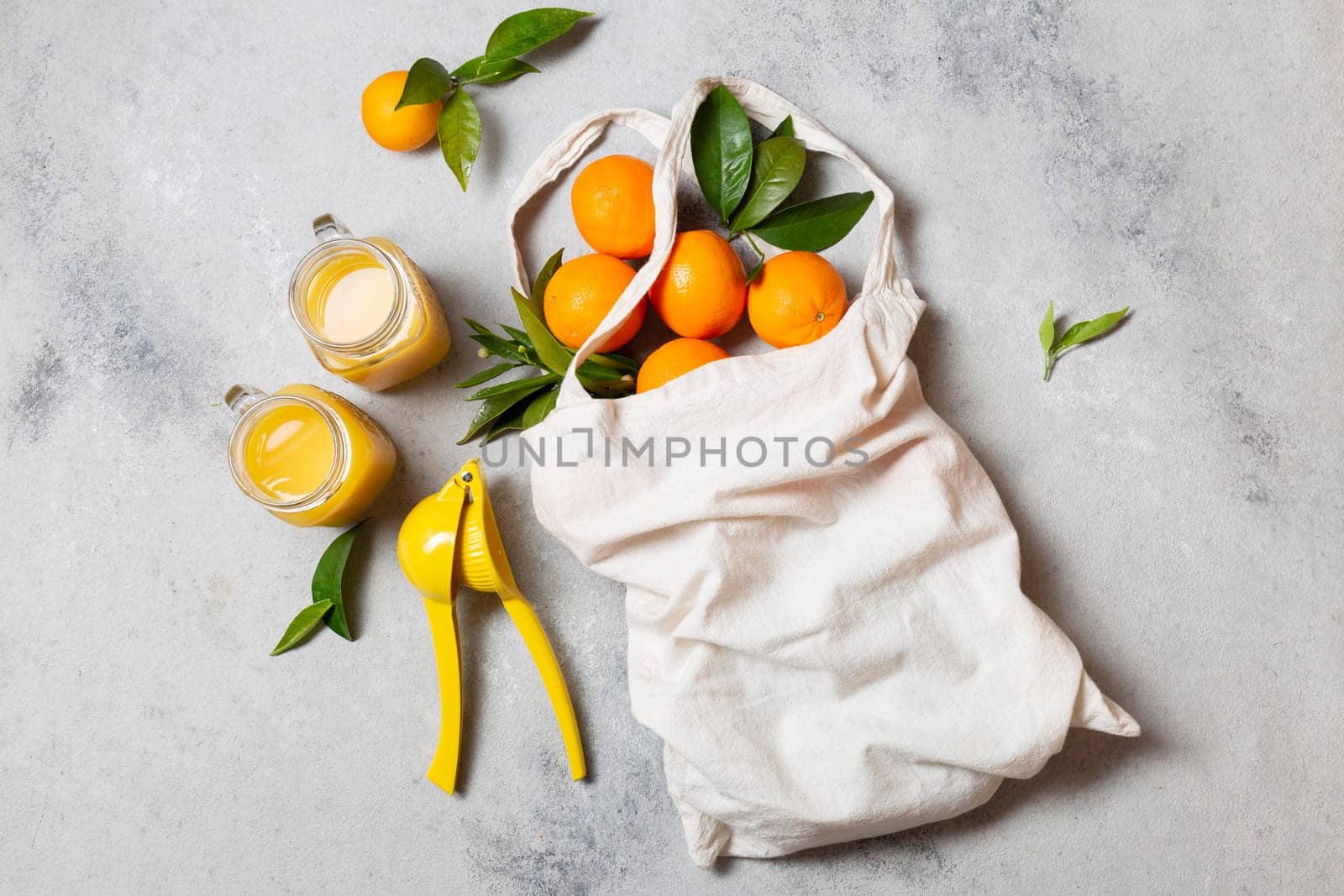 top view tote bag with oranges juice. High resolution photo