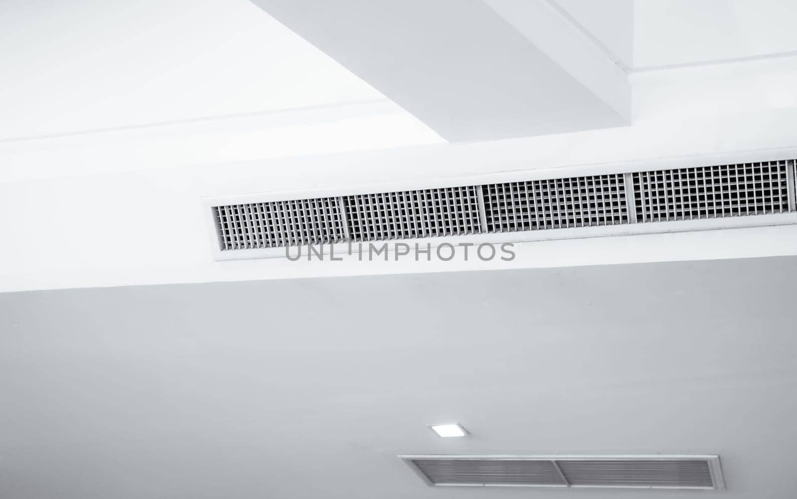 Air flow and ventilation system. Air Handling Units on ceiling walls for efficient cooling. Building ventilation. Air Handling Units and climate control systems. Ceiling-mounted ventilation units.