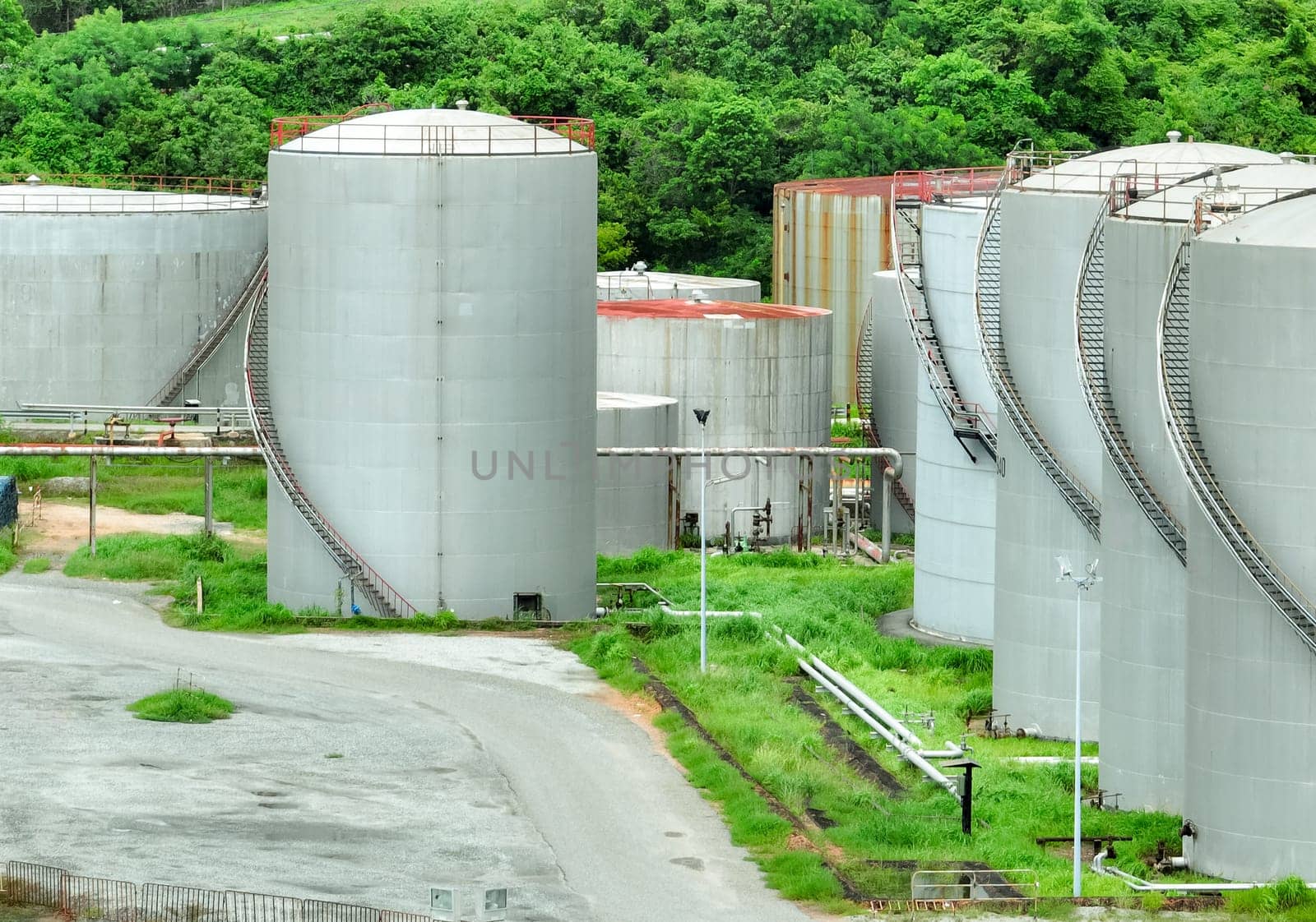 Gas storage tanks in oil refinery and petrochemical plant. Pipelines and industrial infrastructure for energy production and fuel storage in oil and gas industry. Energy supply and fuel production.