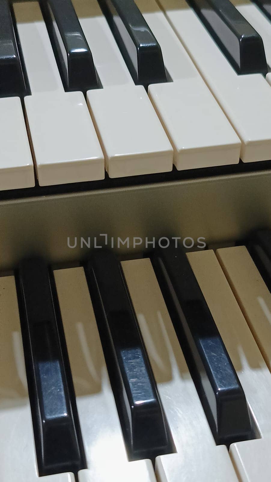 Close-up of an electronic organ in a cozy music room.