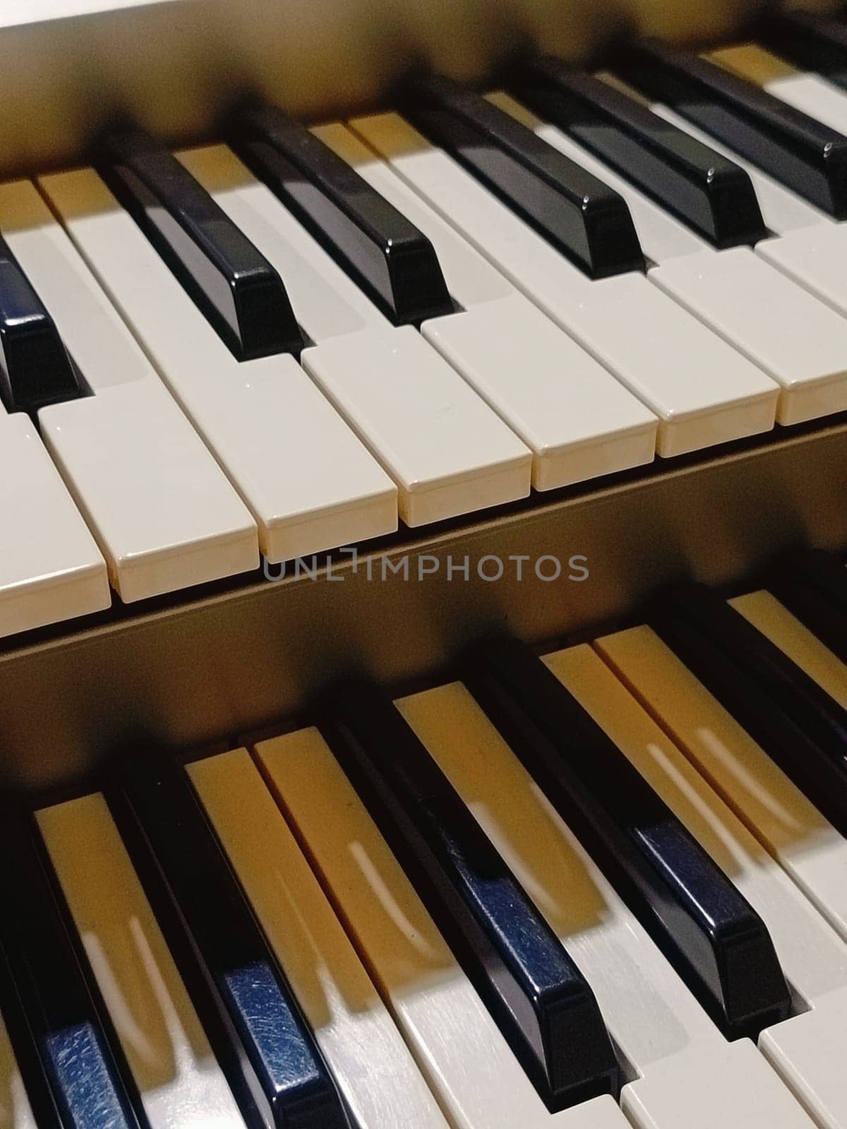 Close-up of an electronic organ in a cozy music room.