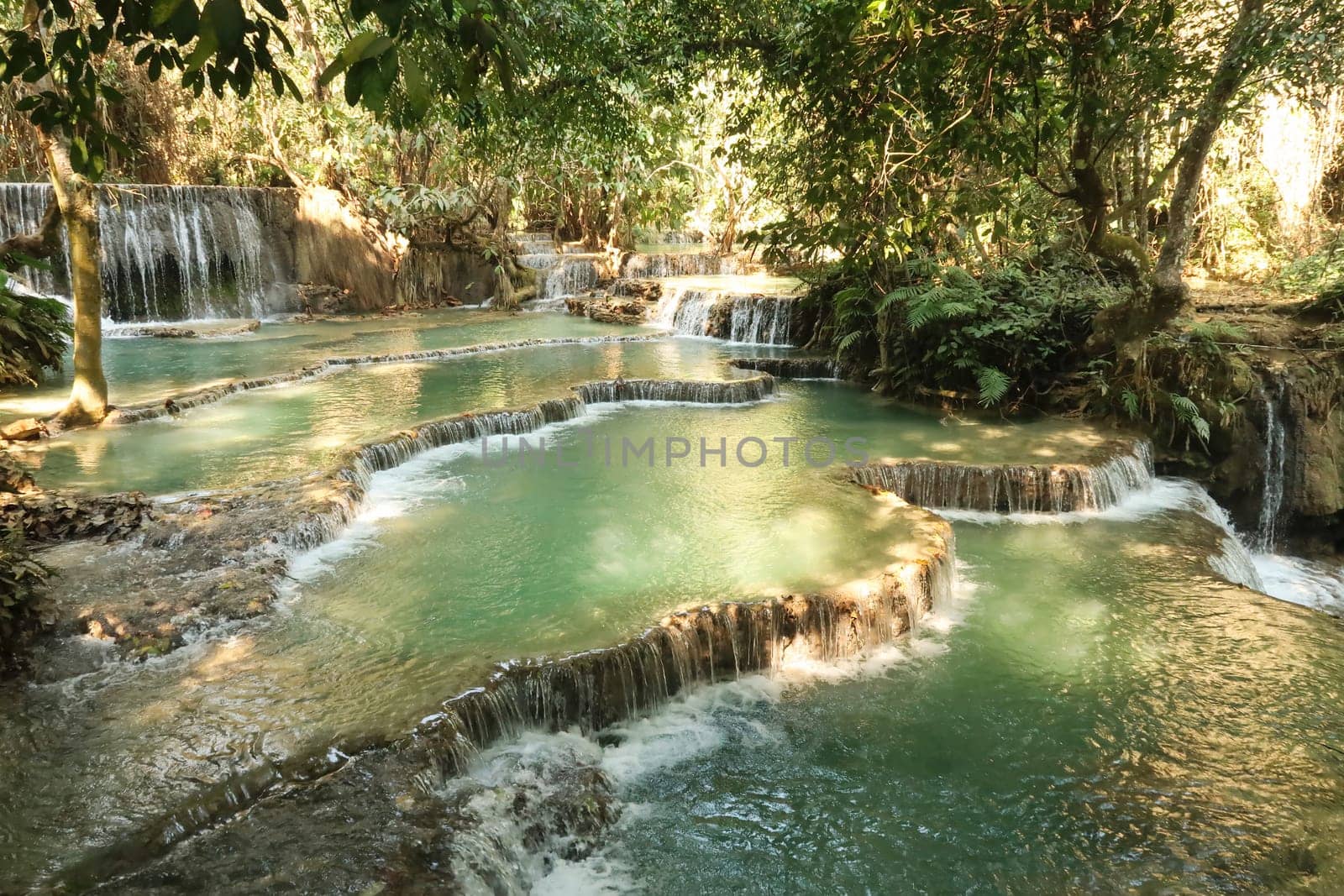 Emerald green water in the many pools of the Kuang Si Falls, Waterfalls, close to Luang Prabang, Laos 2023