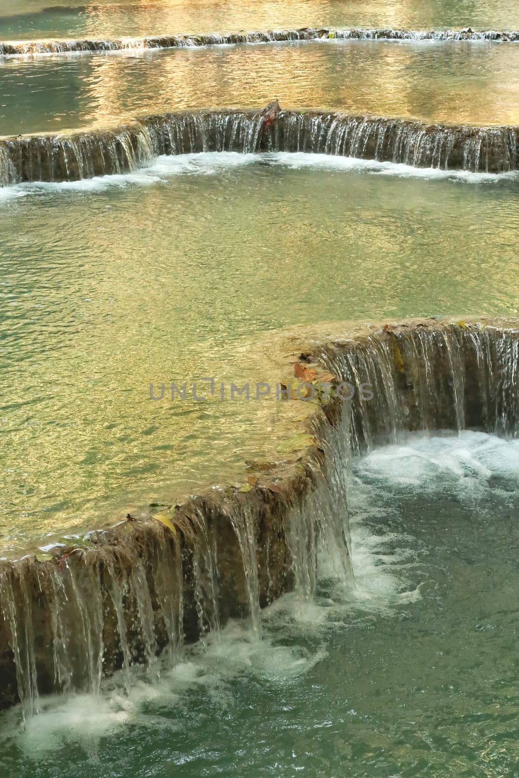 The pools, lagoons of the Kuang Si Falls, Waterfalls with its emerald green water, Luang Prabang, Laos 2023
