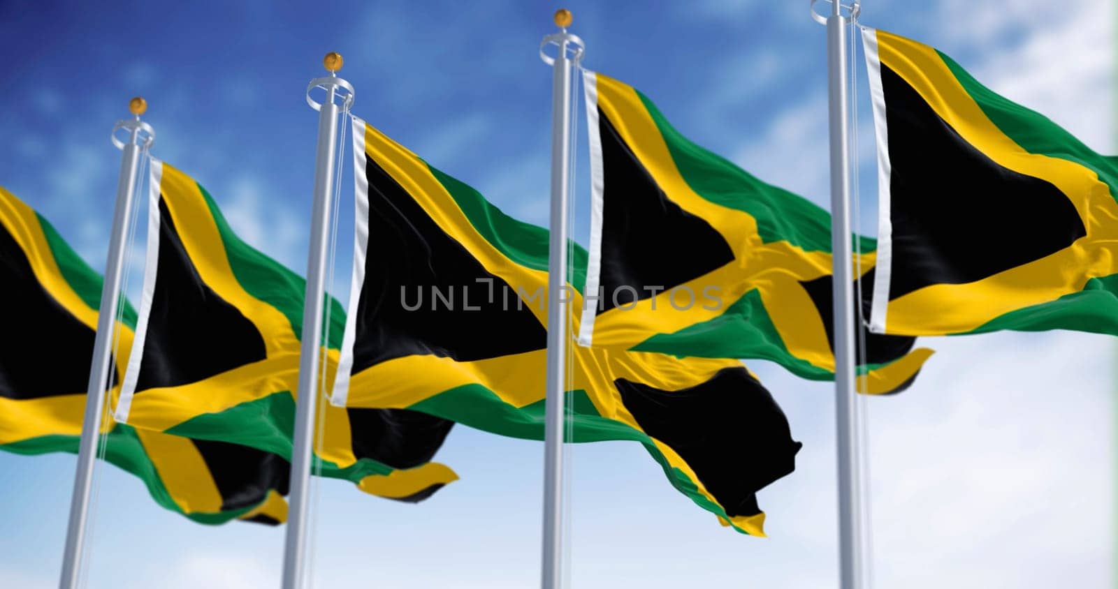 Close-up of Jamaica national flag waving. Gold saltire dividing it into four sections: two green and two black. 3d illustration render. Fluttering fabric. textured background