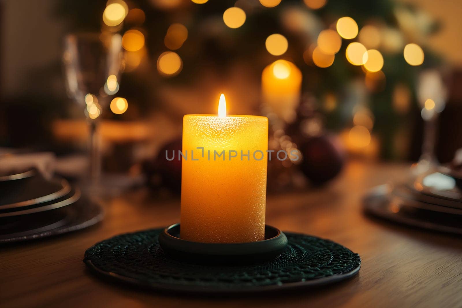 A flickering candle casts a warm glow on a beautifully set dining table surrounded by twinkling holiday lights.