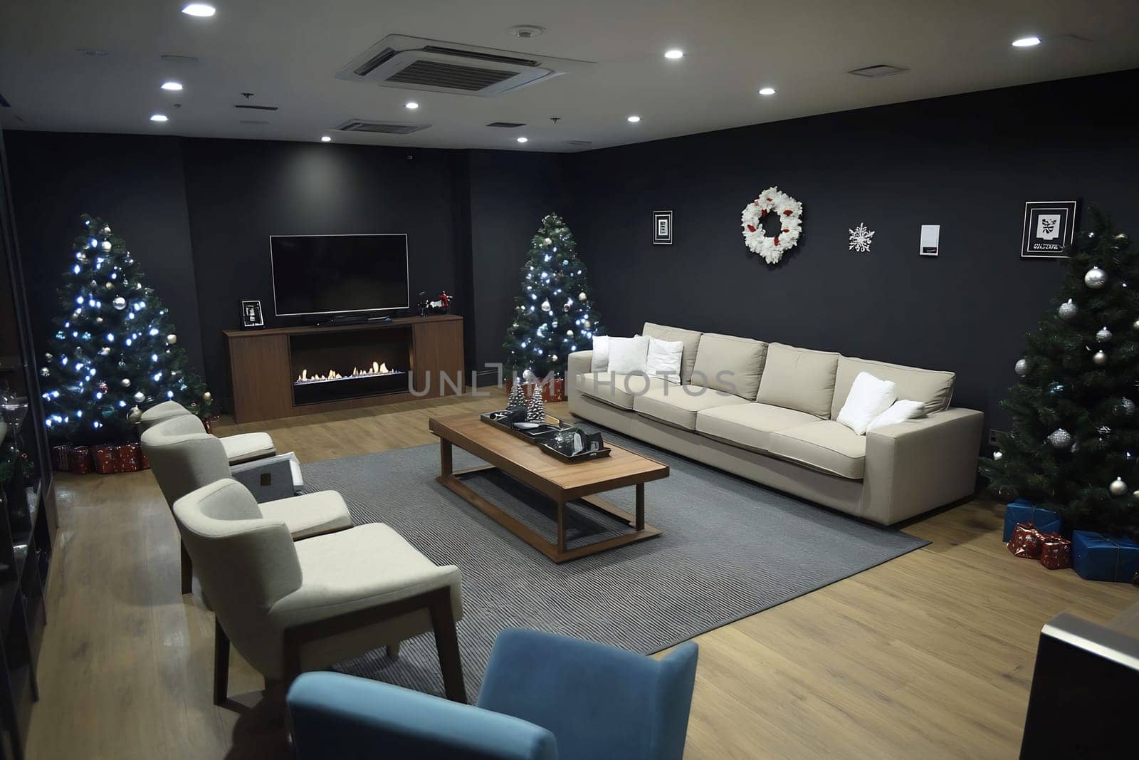 A modern living room features two decorated Christmas trees, holiday presents, and a comfortable seating arrangement, creating a festive atmosphere.