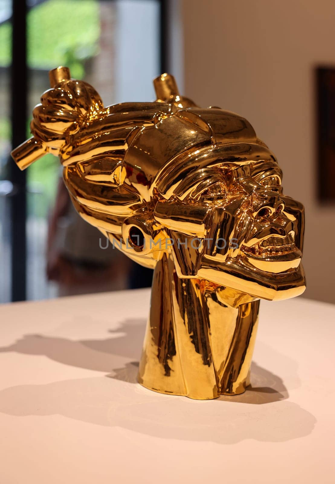 Venice, Italy - May 7 2024: Foreigners Everywhere 60th Venice Art Biennale in Venice. Gioia by Victor Fotso Nyie. Glazed ceremic and gold.