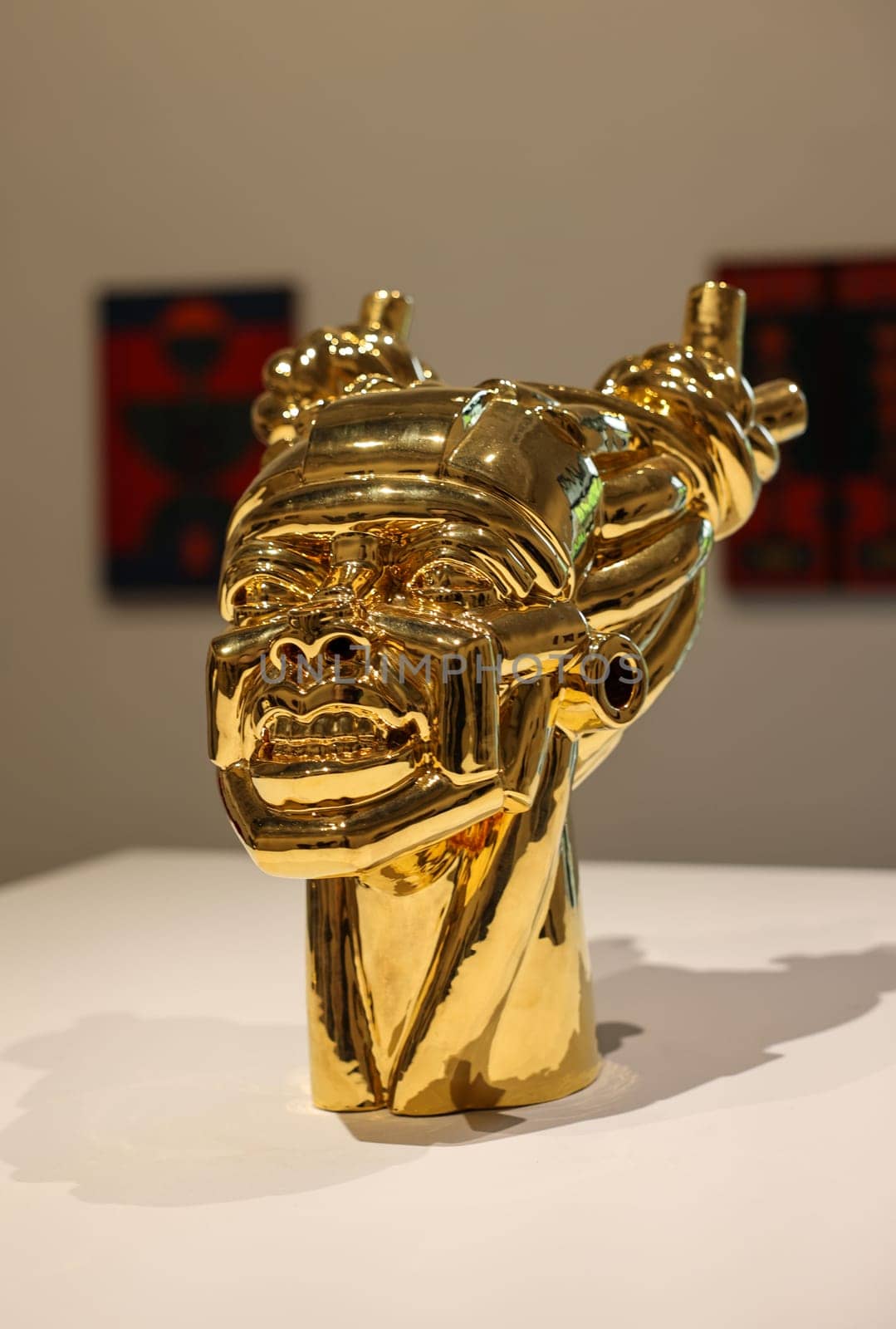 Venice, Italy - May 7 2024: Foreigners Everywhere 60th Venice Art Biennale in Venice. Gioia by Victor Fotso Nyie. Glazed ceremic and gold.