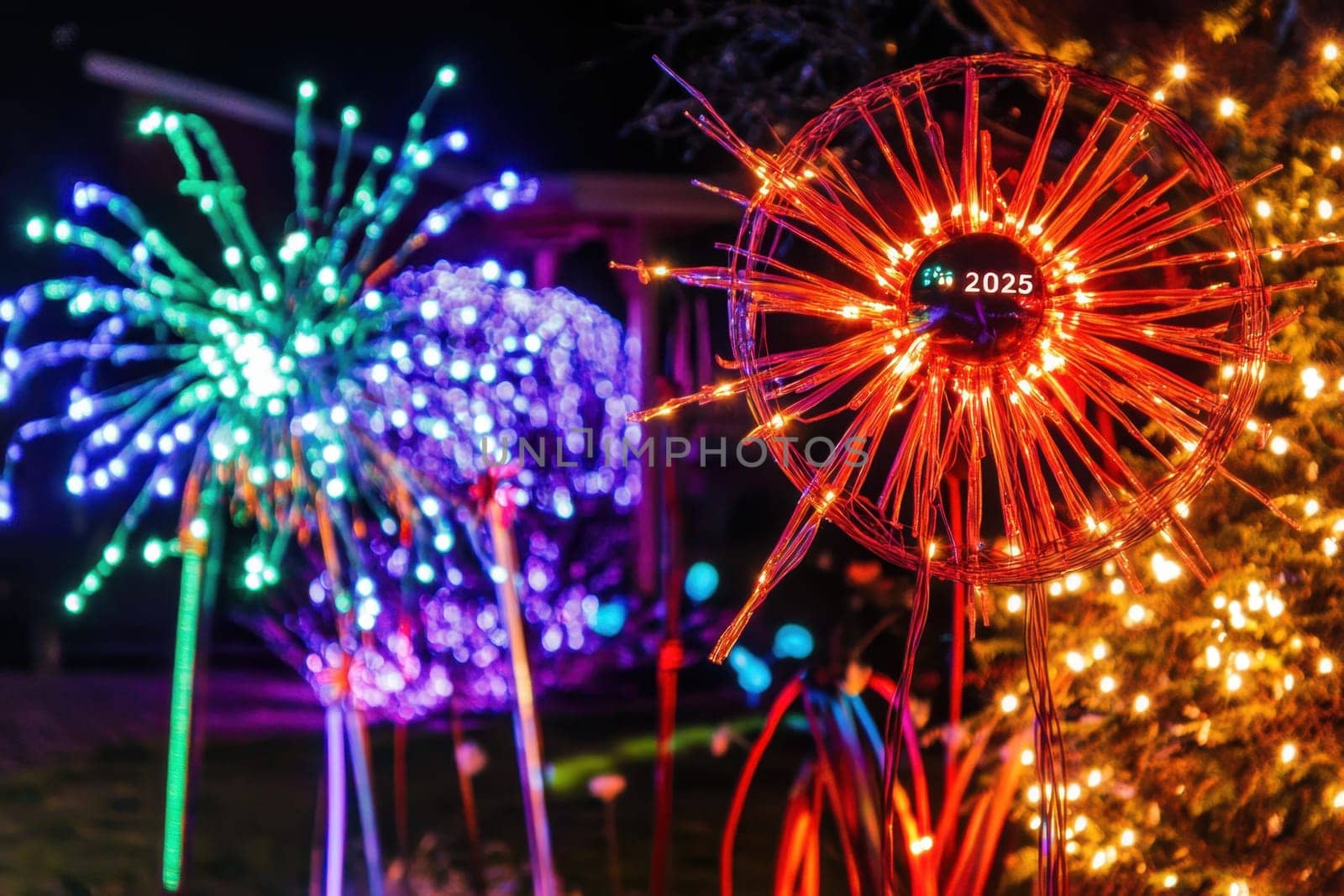 Bright LED lights create stunning patterns in a garden celebrating the festive spirit with vibrant colors and holiday cheer during winter.