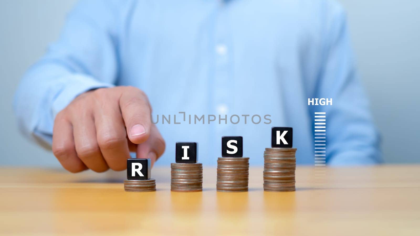Risk management concept, RISK word print on black block on coins money with up arrow and percent for financial banking increase interest rate or investment dividend from, Investment Safety.