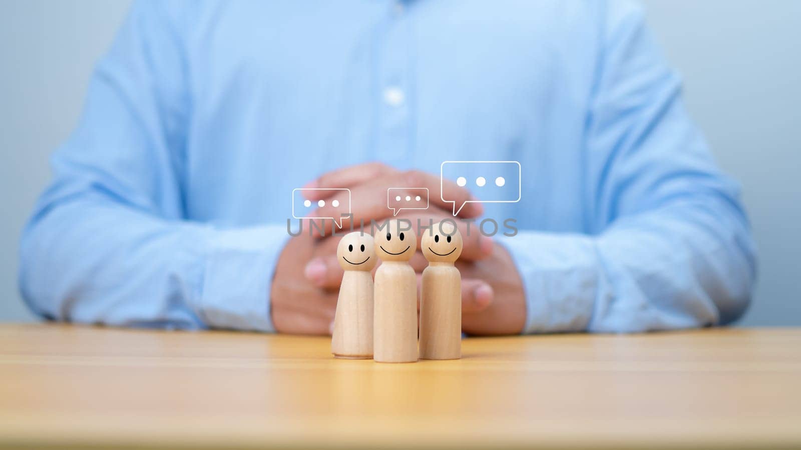 Wooden doll figure with communication and technology symbols, Social media and technology concept, Conversation exchange of ideas in an organization or in society, Joining a group listening.
