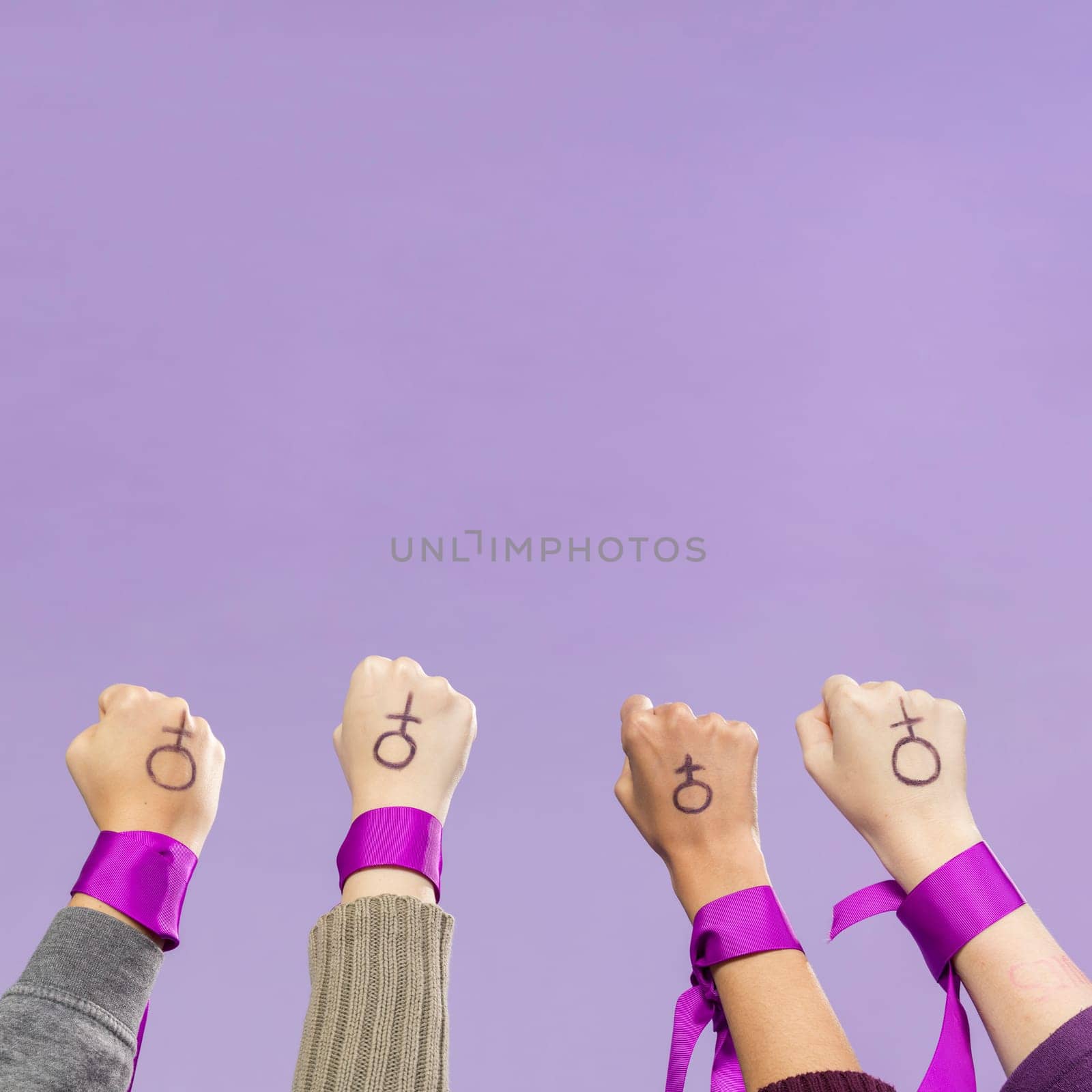 group female activists protesting together. High resolution photo