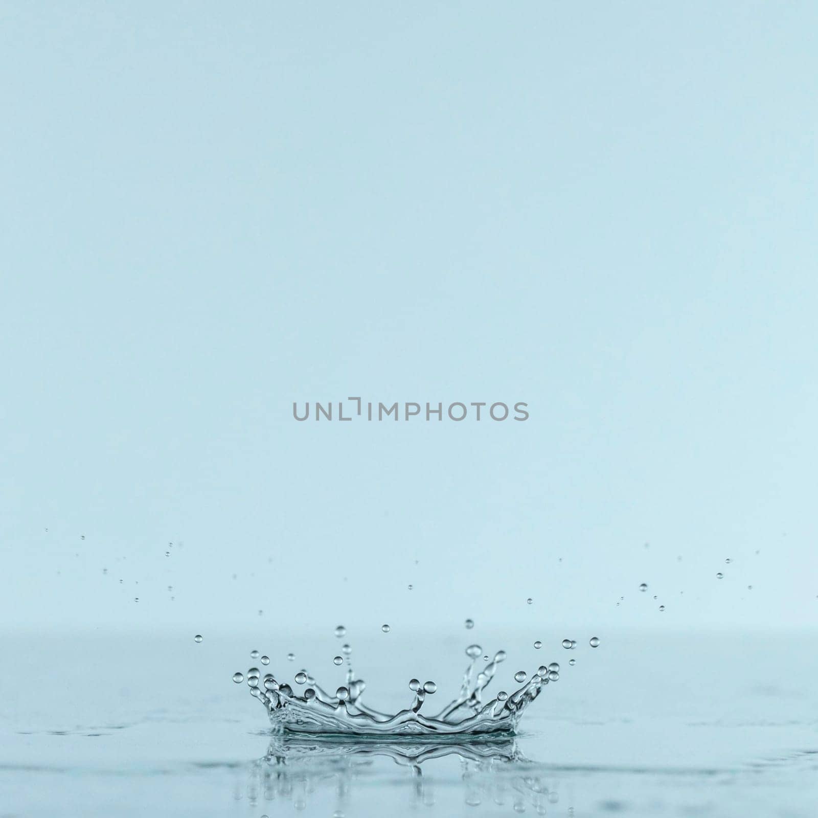front view splash water from drop with copy space. High resolution photo