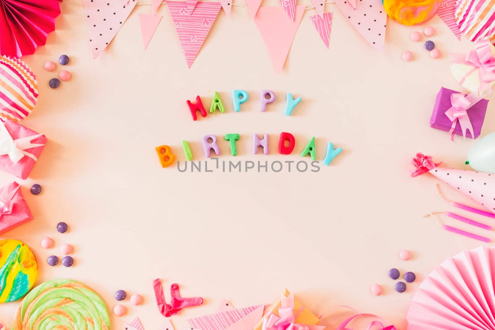 happy birthday text with party concept colored background. High resolution photo
