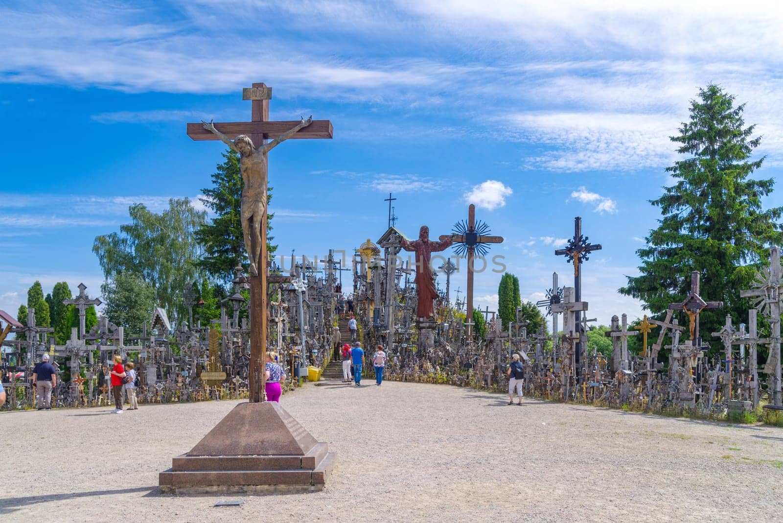 SIAULIAI, LITHUANIA, JUNE 17, 2024: The Hill of Crosses is a unique sacral site covered in 200,000 crosses of various shapes and sizes. It is a place of pilgrimage and prayer, visited by Pope John Paul II and many other believers.