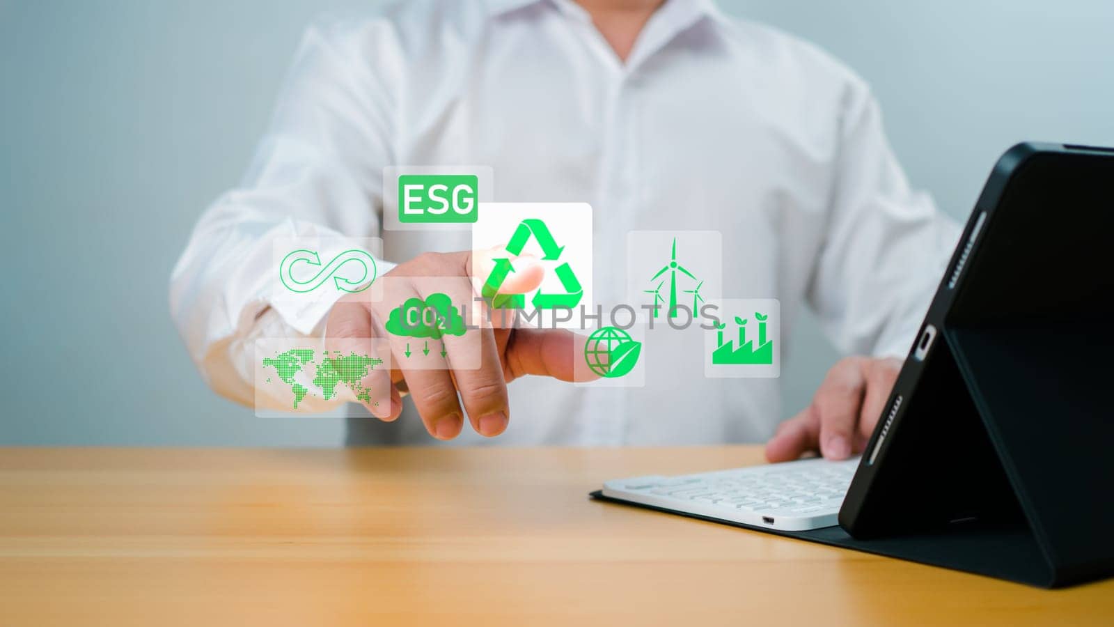 Businessman analyze investment sustainability ESG icons. ESG environmental protection concept, Sustainable development, Climate change, Green energy recycle, Net zero and carbon neutral.