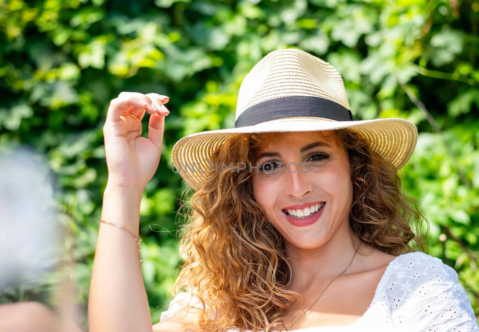 happy young woman with straw hat