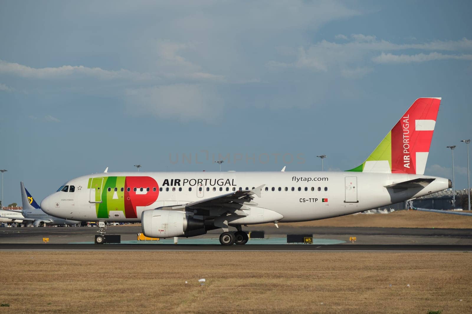 Lisbon, Portugal - September 2, 2023: TAP Air Portugal Airbus A319-111 passenger plane taxi on runway in Humberto Delgado Airport in Lisbon